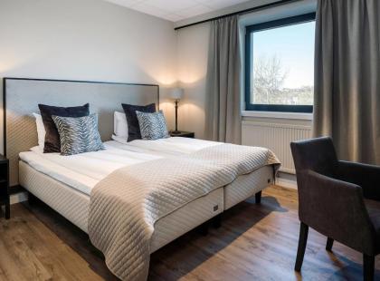 Quality Hotel Grand Royalin tyylikäs kahden hengen huone.