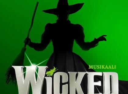 Wicked-musikaalin juliste, jossa noidan siluetti.